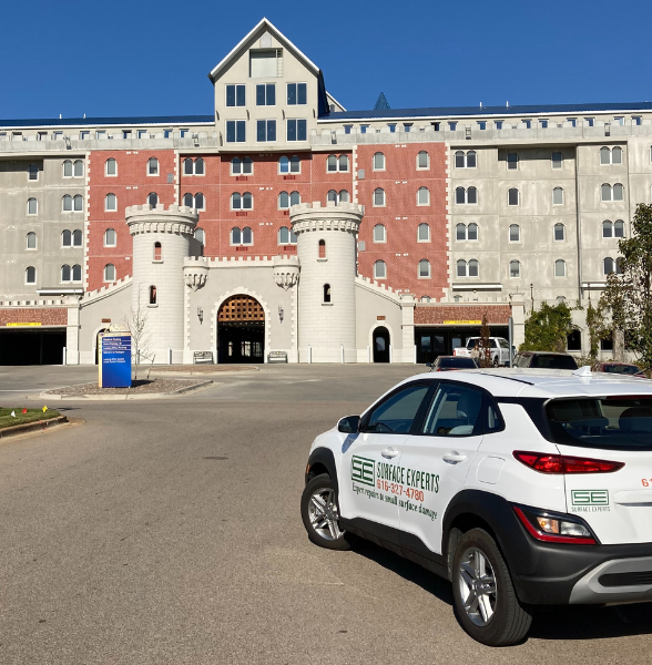 Image of Surface Experts vehicle parked by the castle apartments in Grand Rapids, Michigan.
