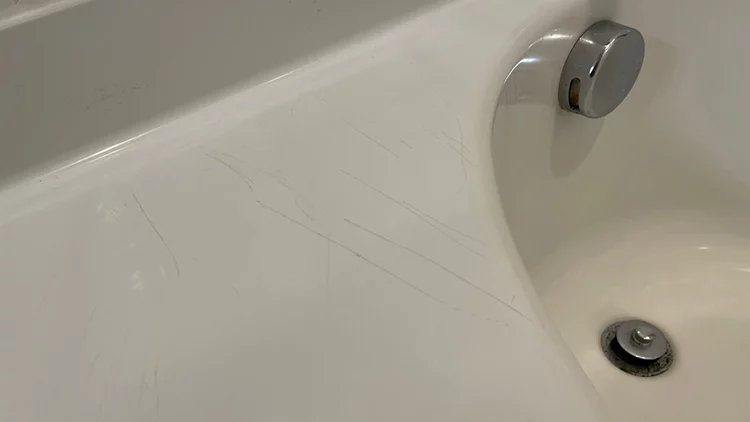 Repairing a cracked bathtub or shower 